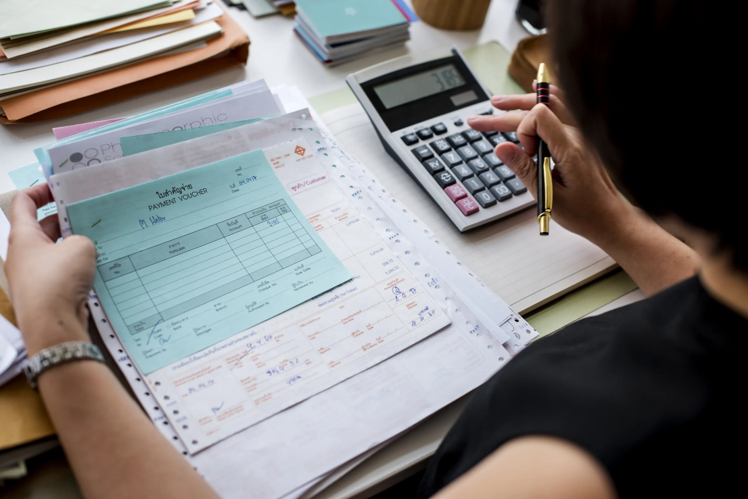 Home asian woman working through paperwork