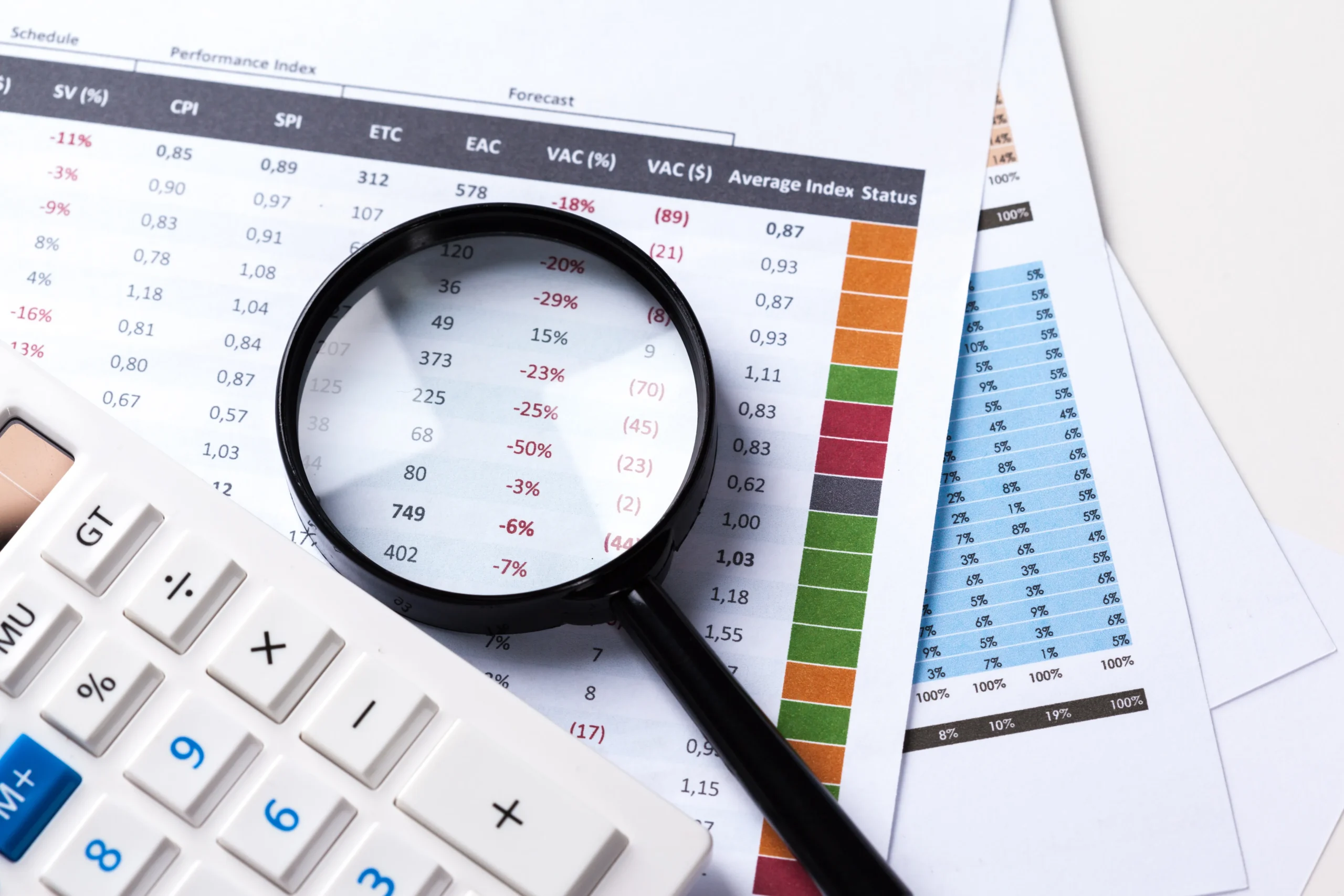Home work with magnifying glass calculator papers